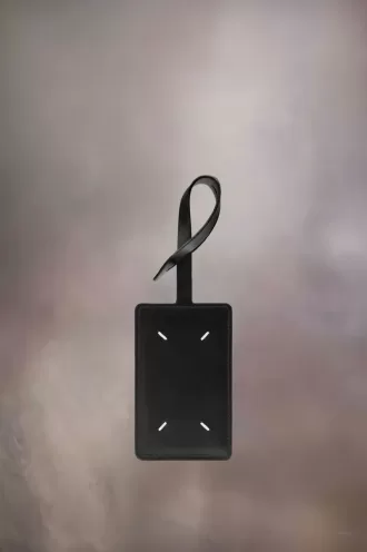 Etichetă pentru bagaje cu patru ochiuri