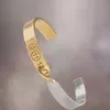 Maison Margiela Manșetă cu numere răsucite Maison Margiela Manșetă cu numere răsucite